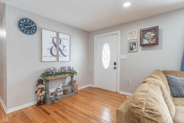 entryway with hardwood / wood-style floors