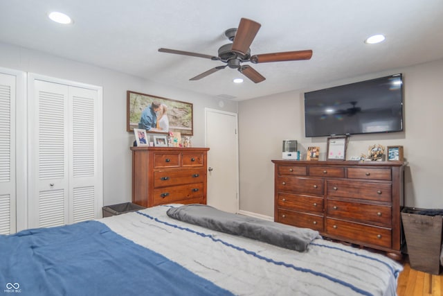 bedroom featuring hardwood / wood-style floors and ceiling fan