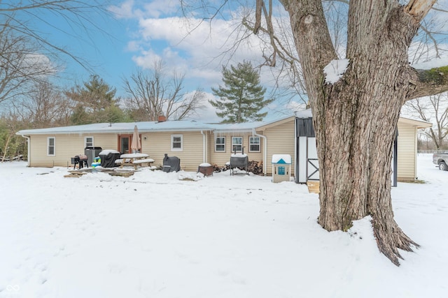 view of snow covered house