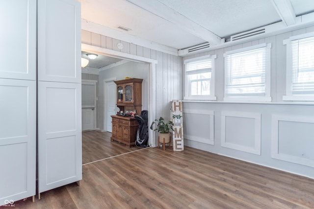 empty room with dark hardwood / wood-style floors