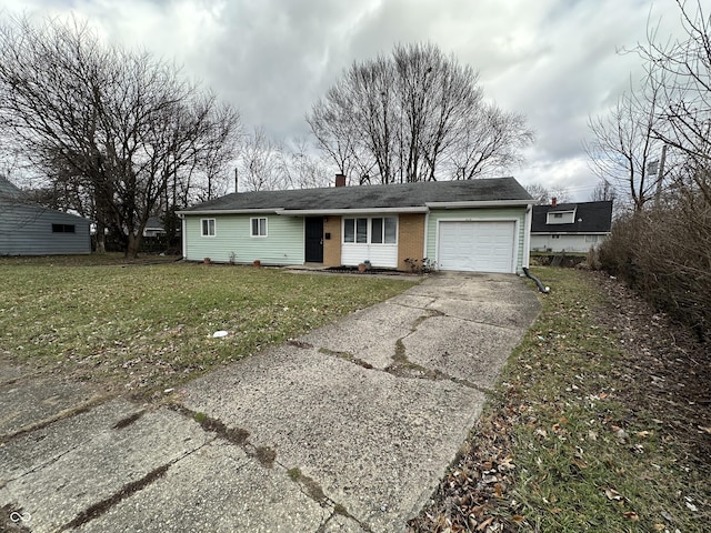 single story home featuring a garage and a front yard