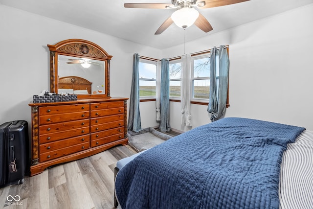 bedroom featuring ceiling fan and light hardwood / wood-style flooring