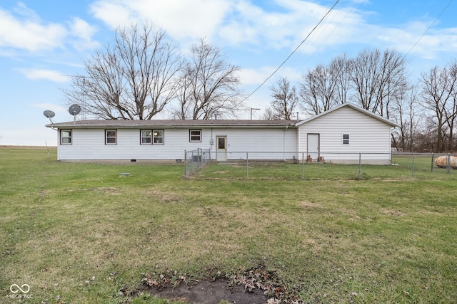 rear view of property with a yard