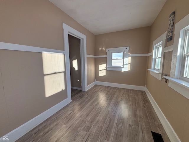 empty room featuring hardwood / wood-style flooring