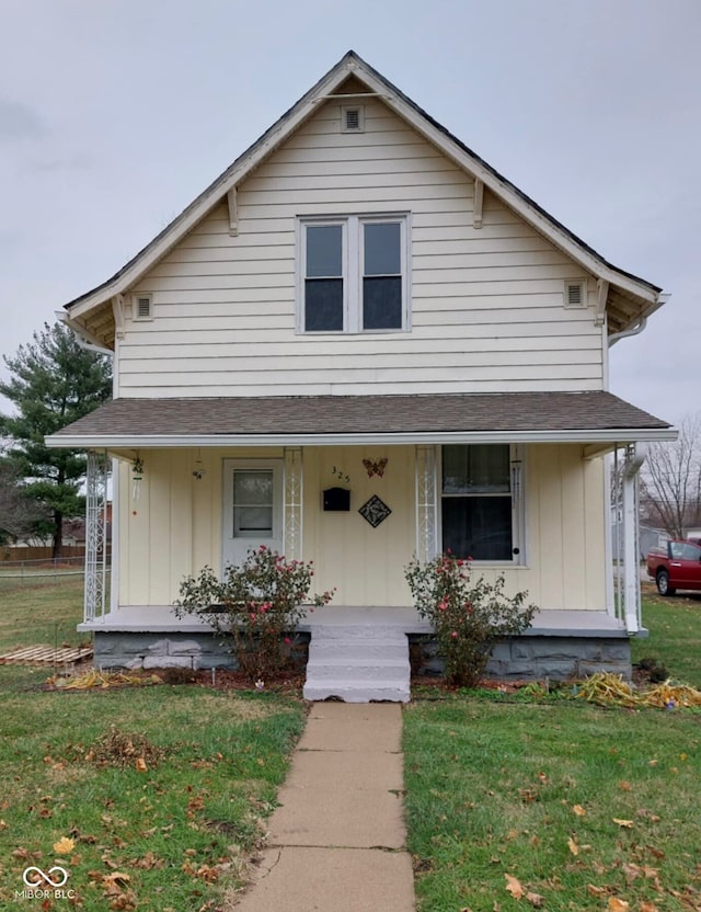 view of front of house featuring a porch and a front yard