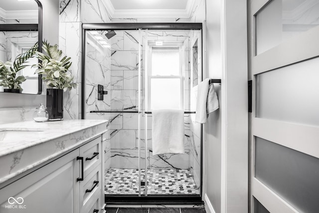 bathroom with walk in shower, ornamental molding, and vanity