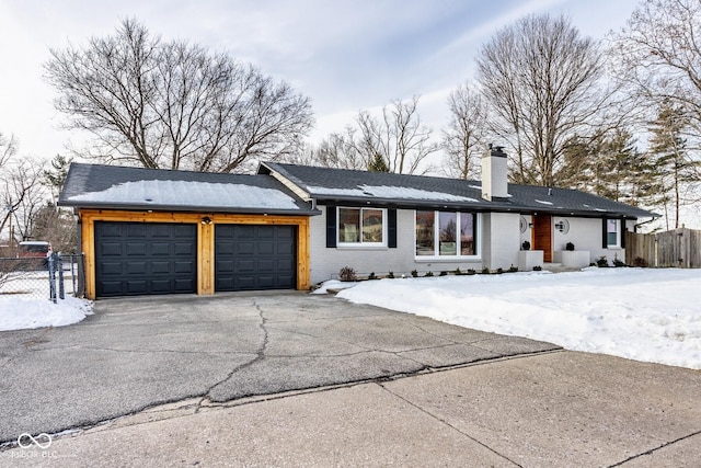 ranch-style home with a garage