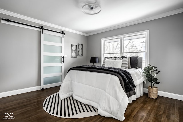 bedroom with ornamental molding, a barn door, and dark hardwood / wood-style flooring