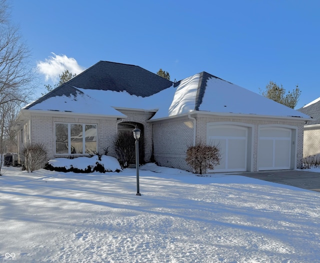 ranch-style house featuring a garage