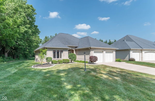 view of front of property featuring a garage and a front yard