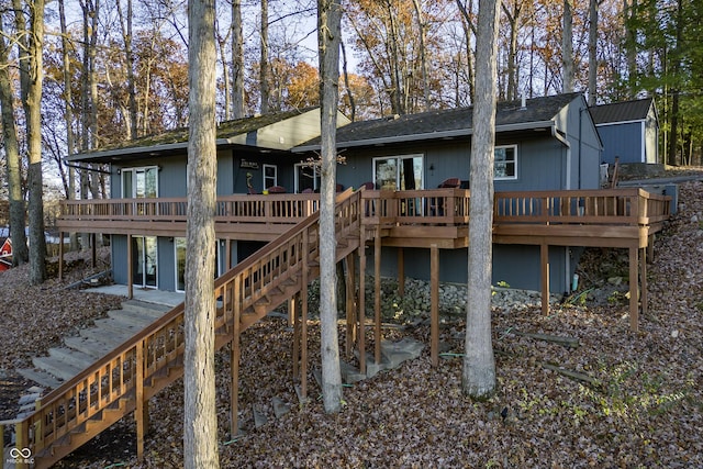 rear view of house with a wooden deck