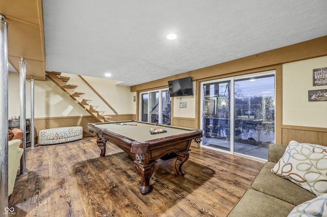 recreation room featuring wood-type flooring, wood walls, and pool table