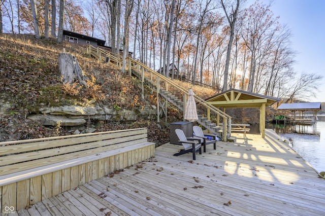 deck featuring a water view and a boat dock