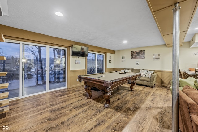 playroom with hardwood / wood-style flooring, wood walls, and billiards