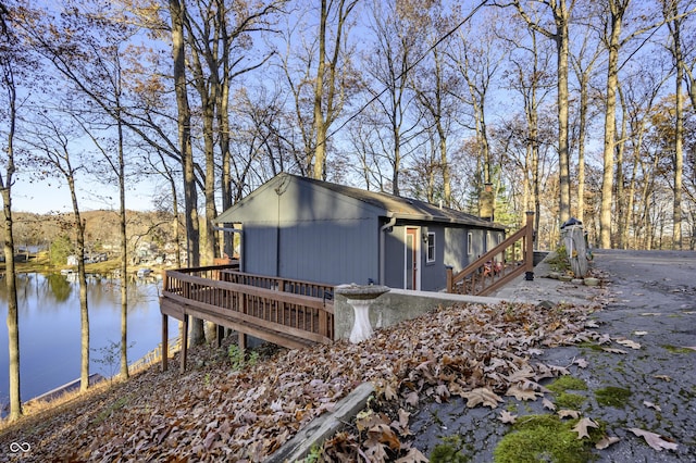 view of property exterior featuring a water view