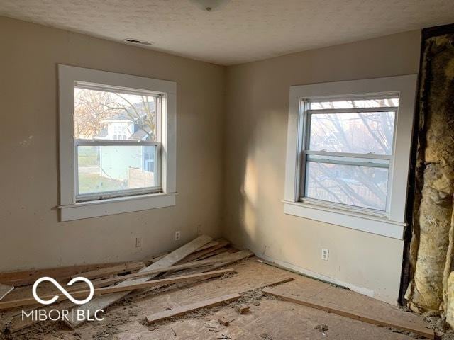 empty room with a textured ceiling