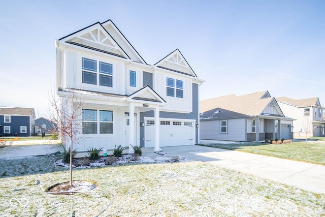 view of front of property with a garage and a front yard