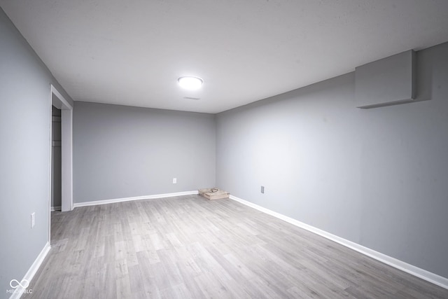 unfurnished room with light hardwood / wood-style floors