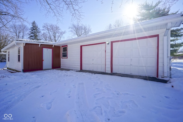 view of snow covered garage