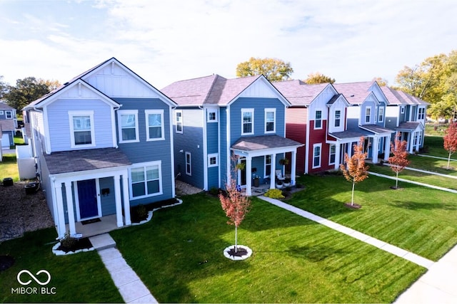 view of front of home featuring a residential view, board and batten siding, a front lawn, and roof with shingles