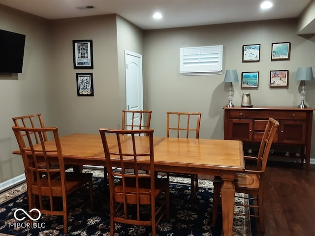 dining area featuring dark hardwood / wood-style flooring