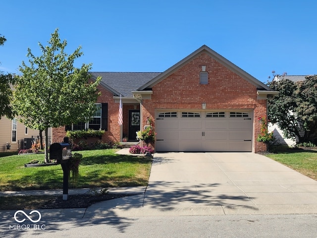 view of front of property with a garage and a front lawn