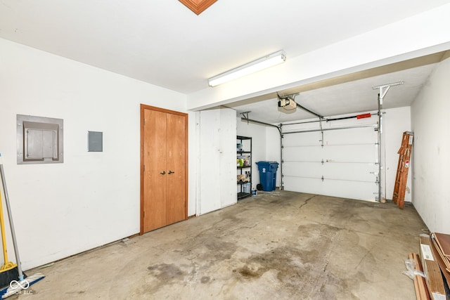 garage featuring a garage door opener and electric panel