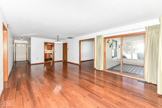 unfurnished living room featuring hardwood / wood-style flooring