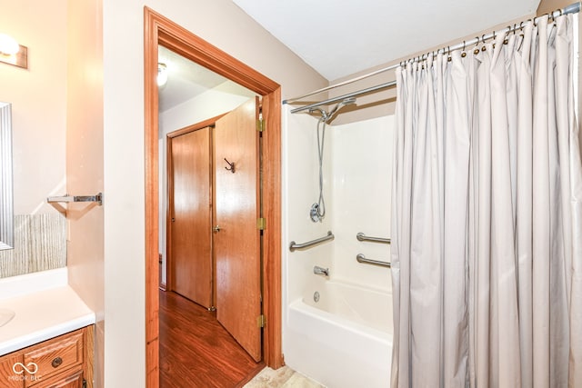 bathroom featuring vanity and shower / bath combination with curtain