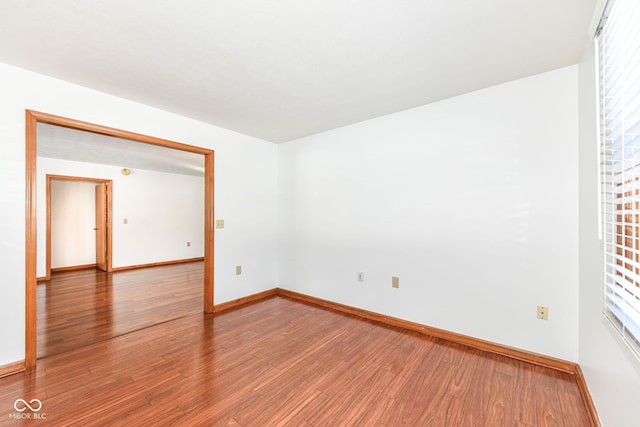 spare room with hardwood / wood-style flooring