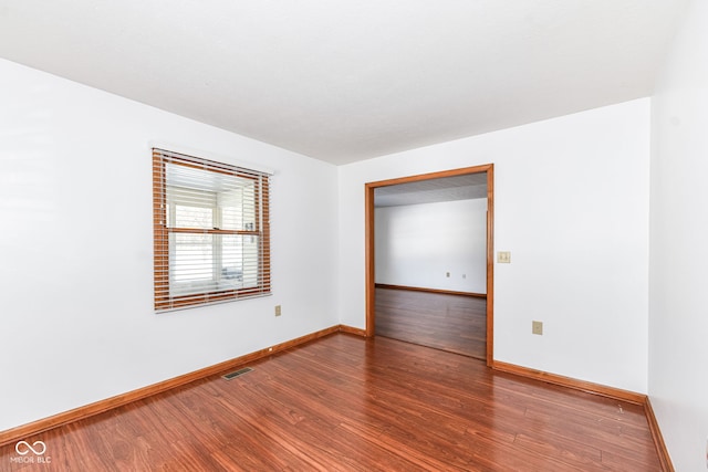 empty room featuring hardwood / wood-style floors