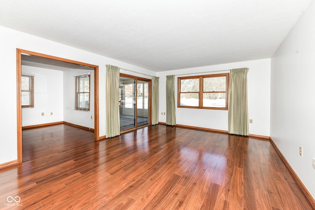 spare room with hardwood / wood-style flooring