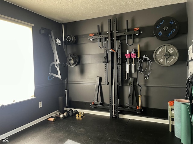 workout area with a textured ceiling