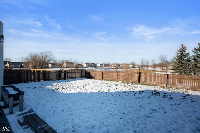 view of yard layered in snow