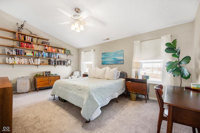 carpeted bedroom featuring lofted ceiling and ceiling fan