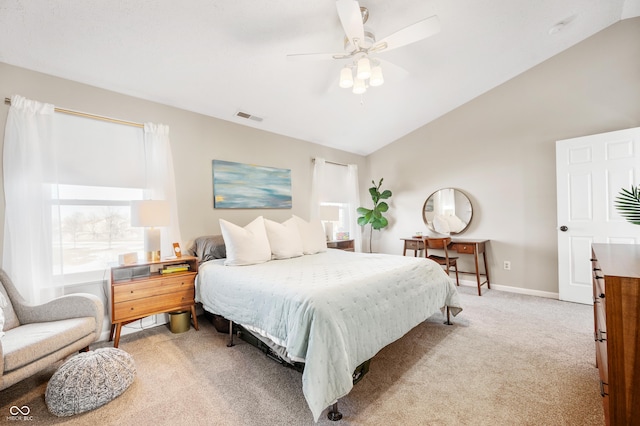 carpeted bedroom featuring ceiling fan and vaulted ceiling