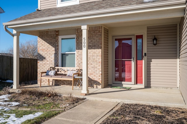 entrance to property featuring a porch