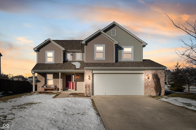 view of front of house featuring a porch and a garage