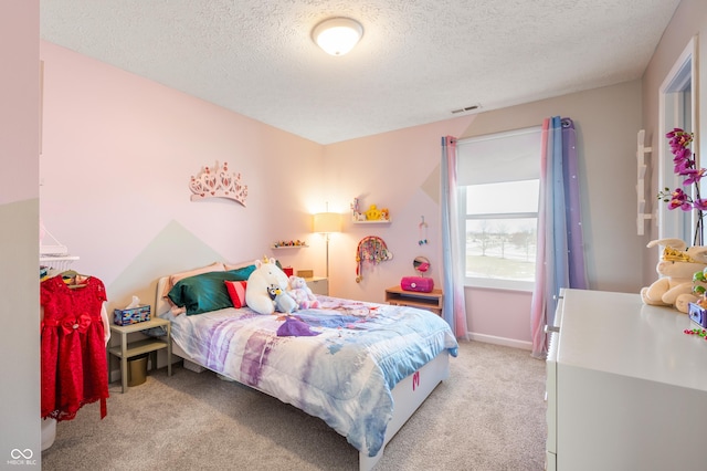 carpeted bedroom featuring a textured ceiling