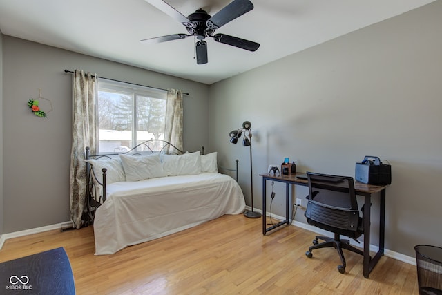 bedroom featuring light hardwood / wood-style floors and ceiling fan