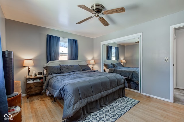 bedroom featuring light wood-type flooring, a closet, and ceiling fan