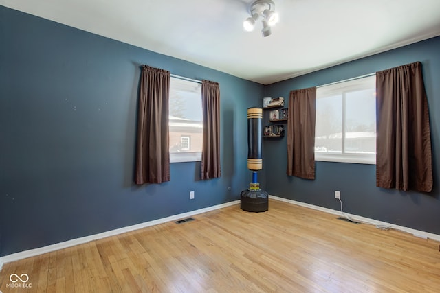 empty room with light hardwood / wood-style floors