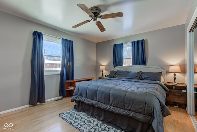 bedroom with ceiling fan and light hardwood / wood-style flooring