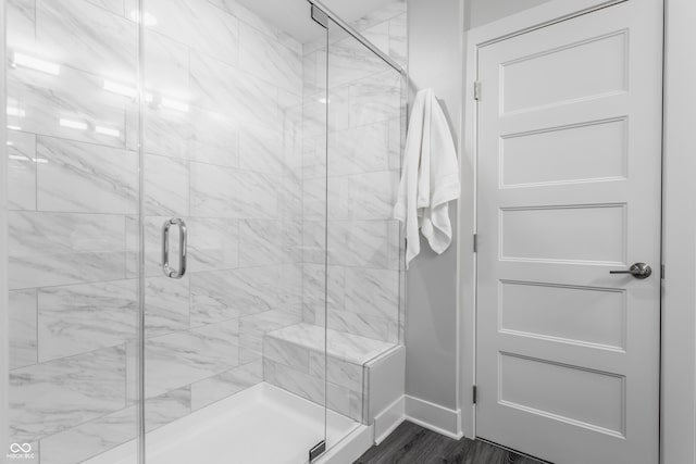 bathroom with a shower with shower door