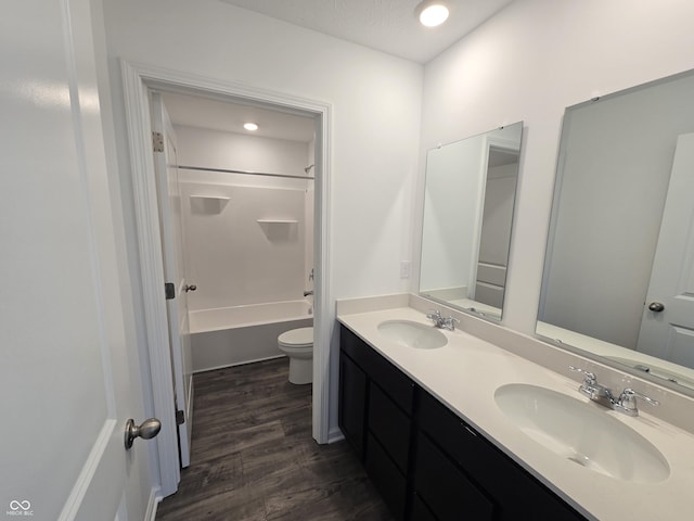 full bathroom featuring vanity, shower / bathtub combination, toilet, and wood-type flooring