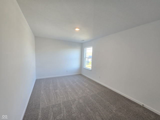 unfurnished room featuring carpet flooring