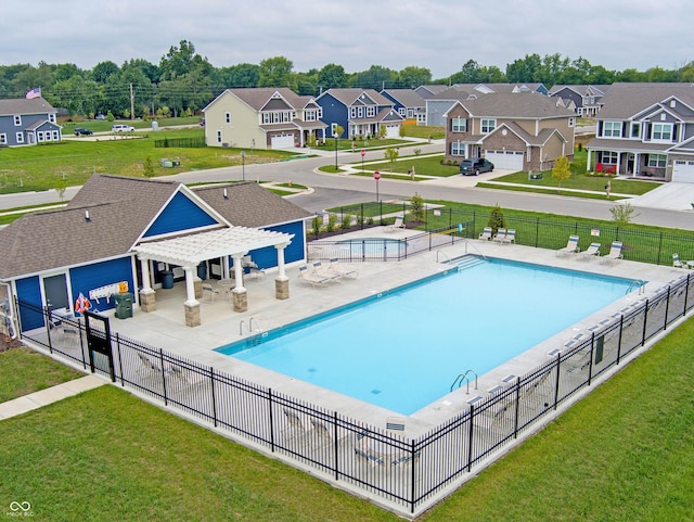 view of pool featuring a patio area and a lawn