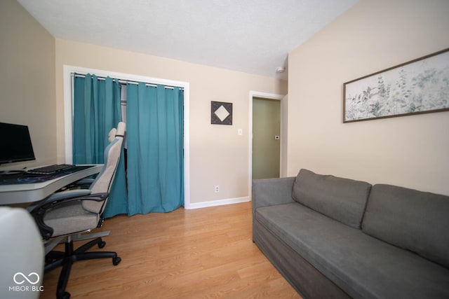 office space with light hardwood / wood-style flooring