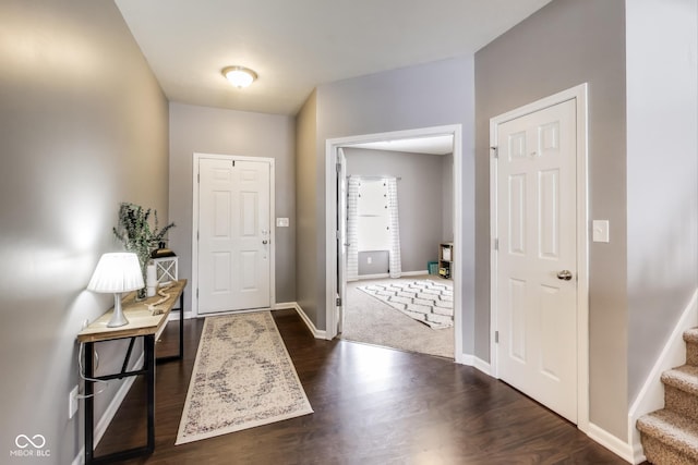 foyer with dark hardwood / wood-style flooring