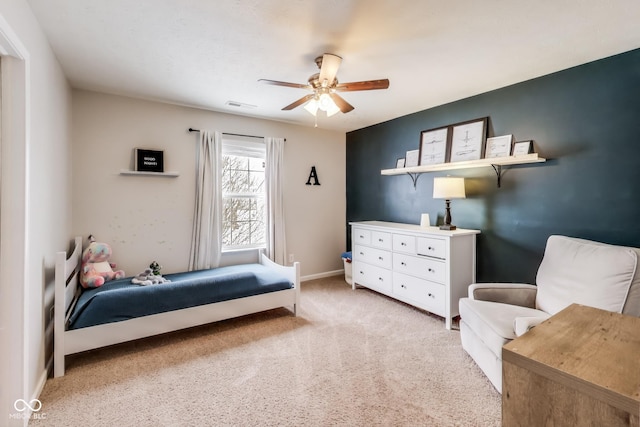 carpeted bedroom with ceiling fan